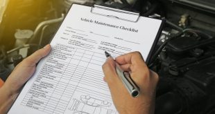 Auto mechanics using a vehicle maintenance checklist