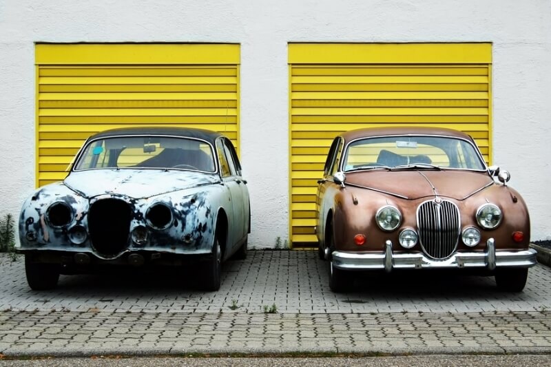 Two used cars parked side by side