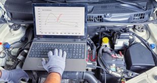 Auto mechanic tuning an ECU using a computer