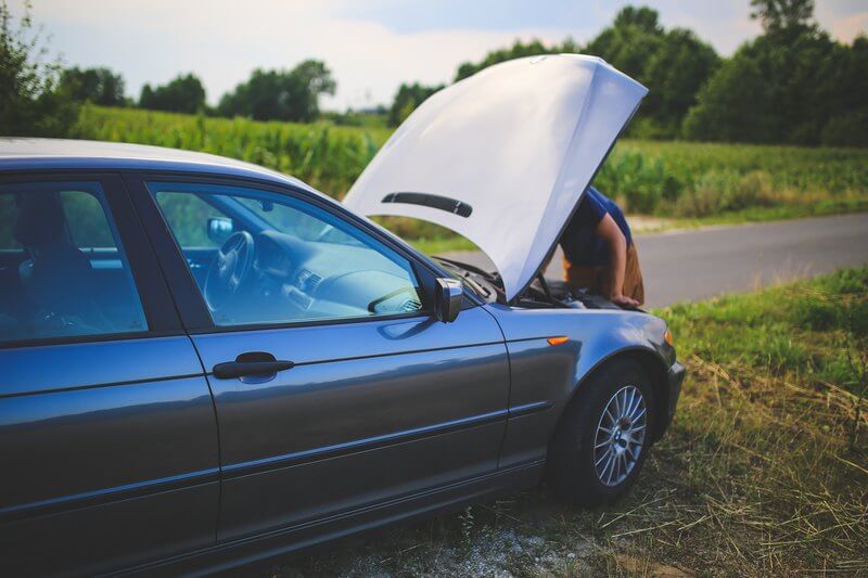 Man fixing his car