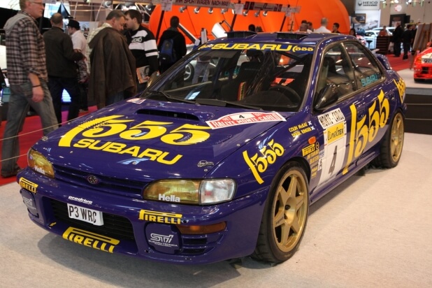 Blue and yellow Subaru Impreza WRX STI - 1st generation