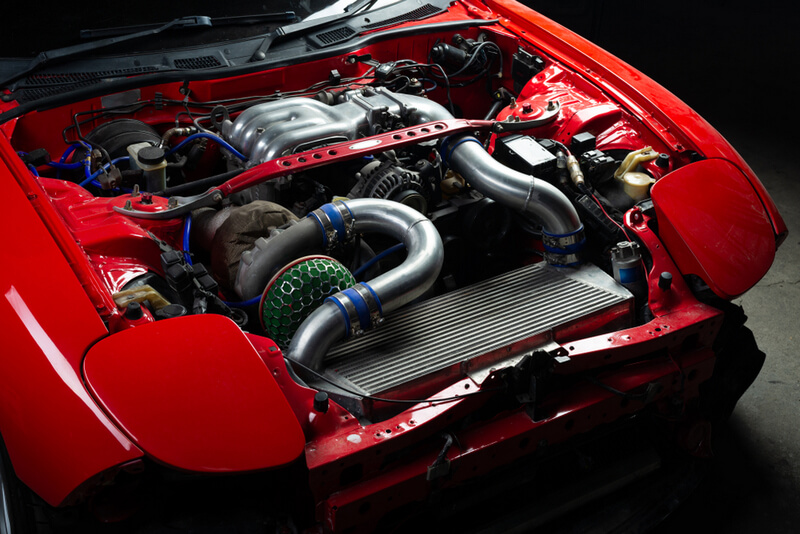 Red Mazda RX-7 FD3S with a 13B-REW engine