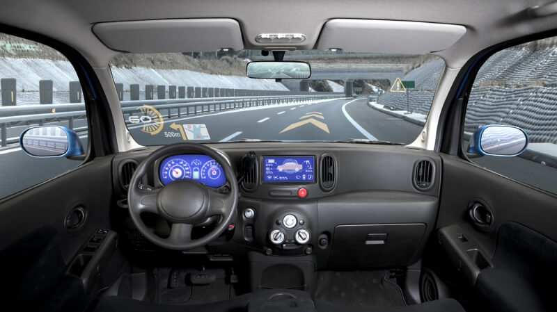 Inside view of a car featuring a heads-up display