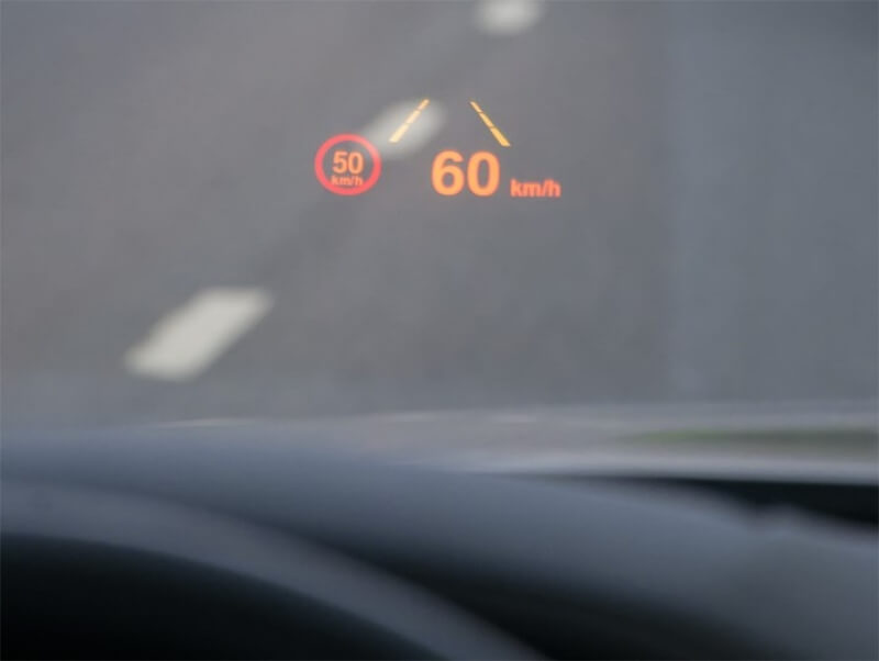 Inside view of a car featuring a heads-up display