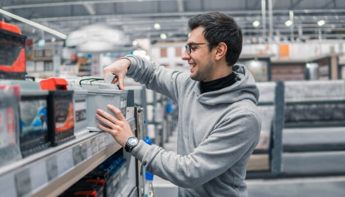 Man buying a new car battery