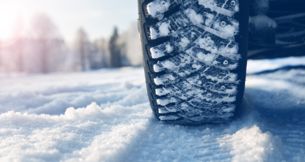 Car driving in the snow equipped with winter tires
