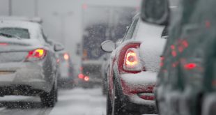 Multiple cars stuck in a traffic jam in the winter