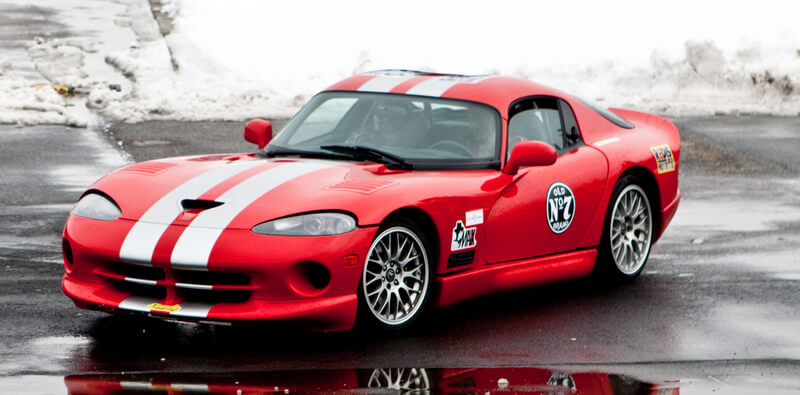 Red Dodge Viper with white racing stripes