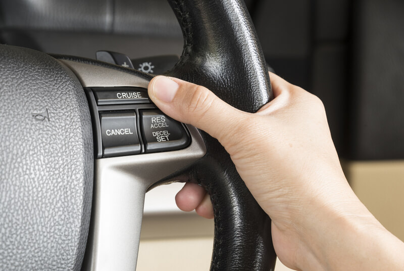 Cruise control switch on a steering wheel