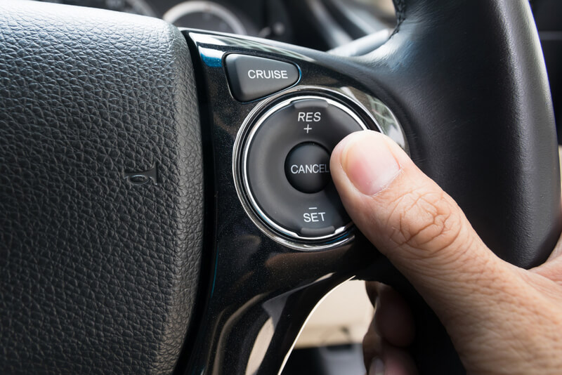 Cruise control switch on a steering wheel