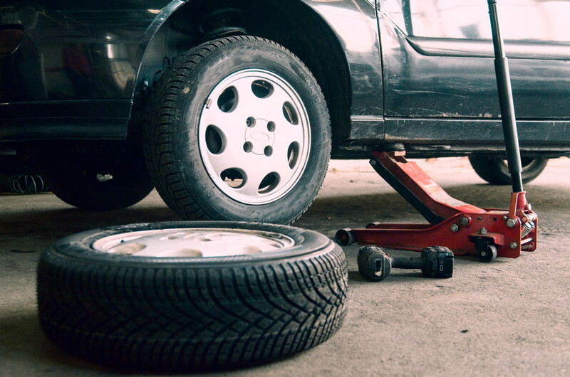 Vehicle jacked to change car tire