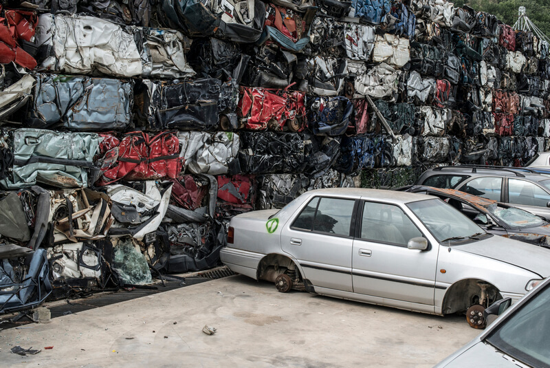 Cars being crushed into cubes