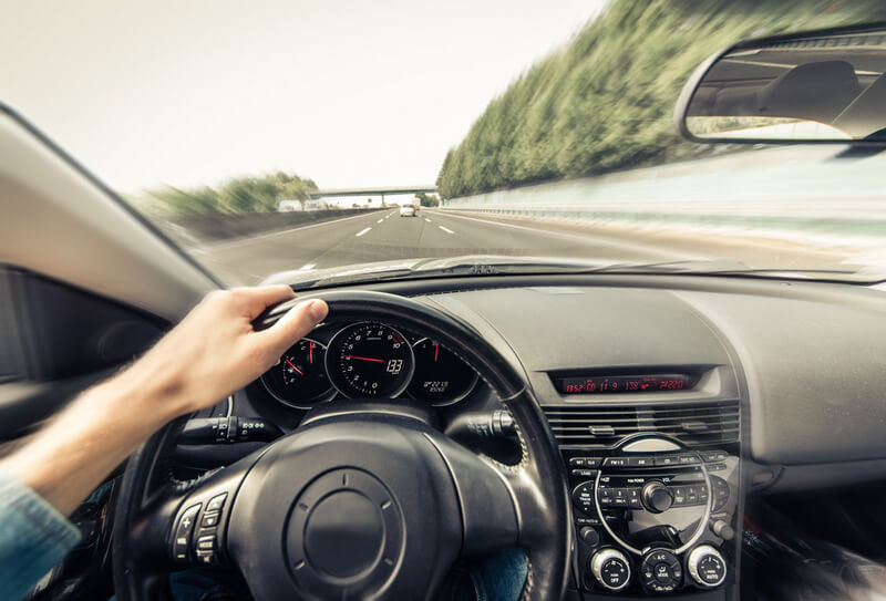 Man driving on the highway using cruise control