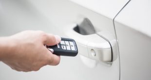 Man unlocking doors with a key fob