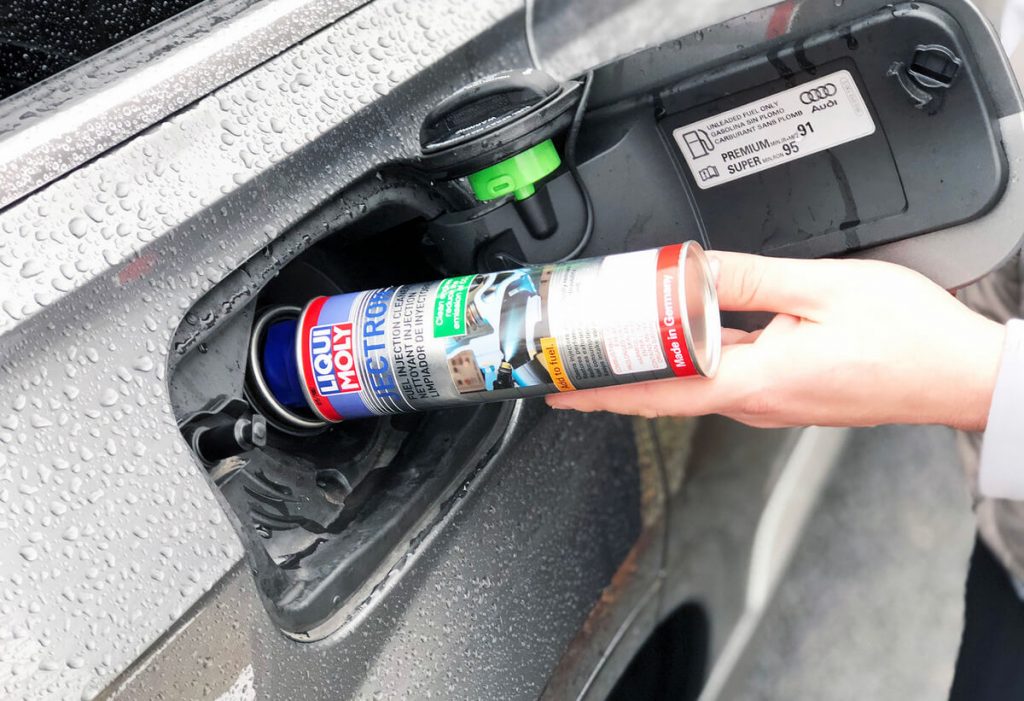 Fuel injector cleaner in tank