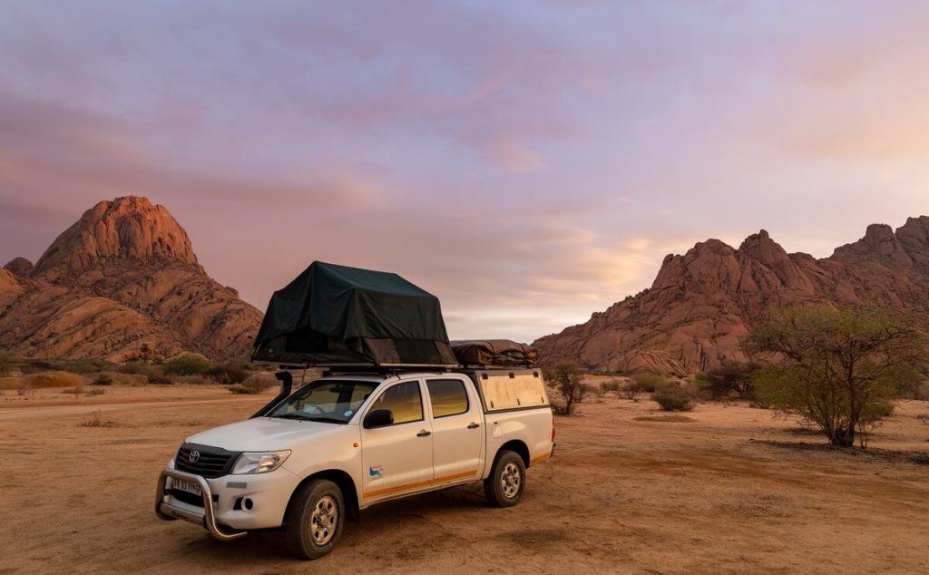 Truck with a rooftop tent in the desert