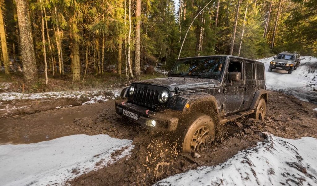 Lifted Jeep Wrangler JK in mud