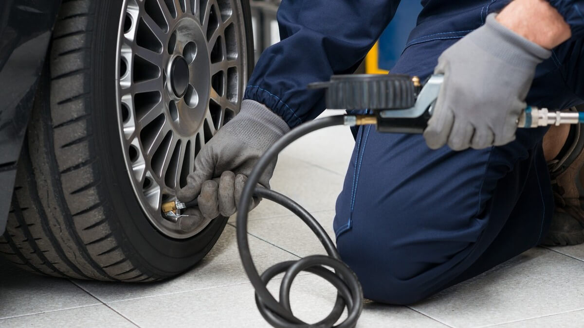 Mechanic inflating tires
