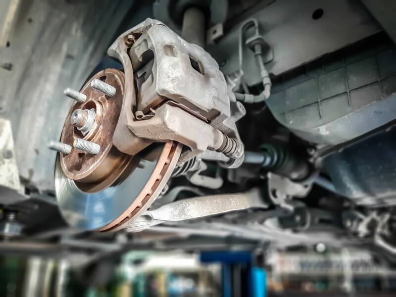 Mechanic replacing brake pads