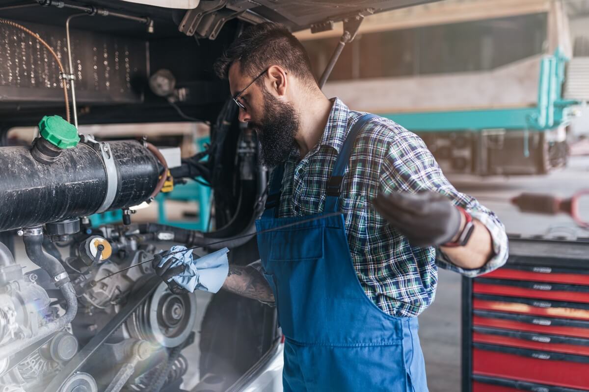 Mechanic working on diesel truck maintenance checklist